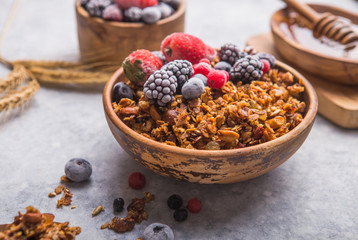 Morning  Granola, Fruits, Berries in bowl on grey concrete background. Healthy breakfast cereals. Concept of dieting, healthy  clean eating