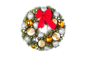 Christmas wreath with a red bow and Christmas toys balls made of beads Isolated on a white background.