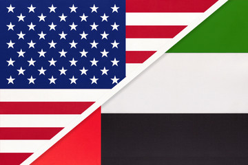 USA vs United Arab Emirates national flag from textile. Relationship between american and asian countries.