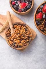 Morning  Granola, Fruits, Berries in bowl on grey concrete background. Healthy breakfast cereals. Concept of dieting, healthy  clean eating