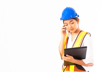 Serious young Architect woman in white shirt and wearing blue safety helmet holding laptop. Occupation concept.