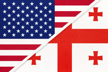 Obraz premium USA vs Georgia national flag from textile. Relationship between two american and asian countries.