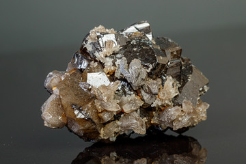 macro mineral cassiterite stone on gray background