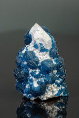 macro mineral stone Fluorite on quartz on a gray background