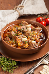 Braised meat with vegetables in a thick sauce.
