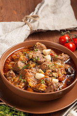 Braised meat with vegetables in a thick sauce.