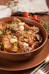 Braised meat with vegetables in a thick sauce.