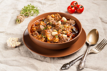 Braised meat with vegetables in a thick sauce.