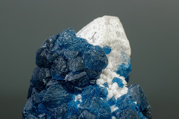 macro mineral stone Fluorite on quartz on a gray background