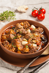 Braised meat with vegetables in a thick sauce.