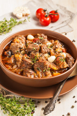 Braised meat with vegetables in a thick sauce.