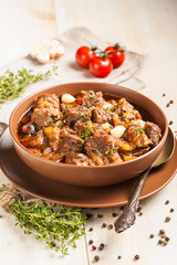 Braised meat with vegetables in a thick sauce.