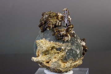 macro mineral stone Prehnite on Epidote on a gray background