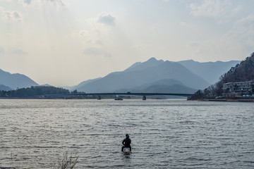 Fototapeta na wymiar Angler at the beautiful Kawaguchi lake