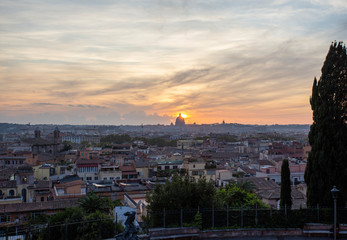 Panoramic view of Rome with St Peters Cathedral in the background during sunset