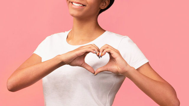 Cropped Image Of Black Woman Showing Heart Gesture