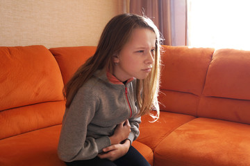 the girl has a stomach ache