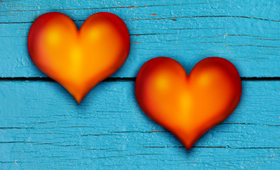 Red hearts on an old blue wooden board. Symbol of love and Valentine's Day