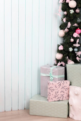 A christmas tree with presents under tree