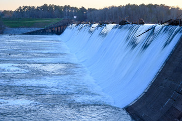 Looking at the water flow over Blewett Falls Dam on the Pee Dee River. Lots of debris is on top at...