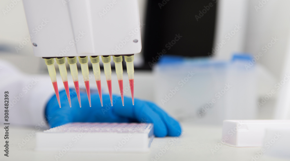 Poster Lab assistant dropping red samples from big pipette in modern laboratory
