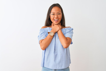 Young chinese woman wearing blue t-shirt and glasses over isolated white background shouting and suffocate because painful strangle. Health problem. Asphyxiate and suicide concept.