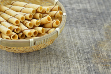 Vanilla waffle roll sticks in bamboo basket