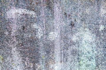 High resolution close up view on a detailed concrete wall texture with some cracks