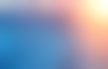 Bright sun light on empty background. Winter sky blurred abstract illustration. Blue red yellow transition defocused pattern.