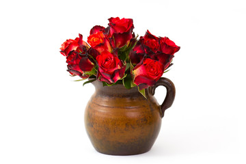 red roses in a vase on white background