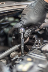 Obraz na płótnie Canvas Removing and changing valves. Car mechanic checking automobile valves