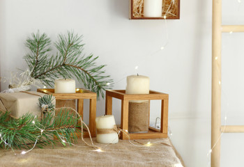 Christmas candles with evergreen decorations.
