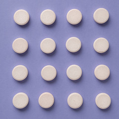  Pattern of pills on colored background. Round white medical pills. Herbal circle drugs. Medical,pharmacy theme background concept