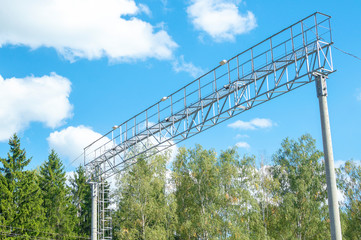 Fototapeta premium Iron arch with surveillance cameras over the tracks