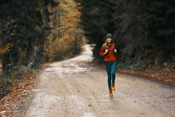 young woman walking in the forest