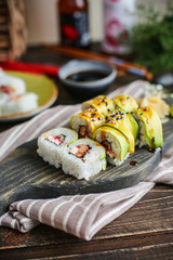 sushi with salmon and avocado. Sushi roll with salmon and tempura shrimp