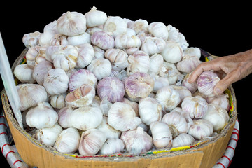 Hand with Garllic die cut, focus selective