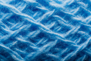 Wool yarn close-up colorful blue threads for needlework in macro.