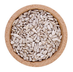 Sunflower seeds on a plate on a white background
