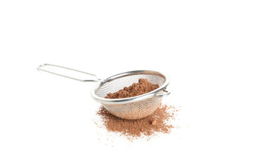 Strainer with cocoa powder isolated on white background