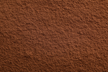 Cocoa powder textured background, close up and space for text