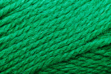 Wool yarn close up colorful aquamarine threads for needlework in macro.