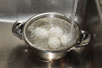 boiled eggs in a pot of water