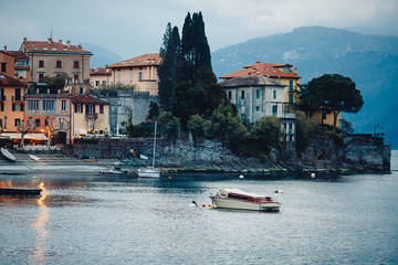 Evening view city Bellagio and Varenna Como water lake Italy blue sky mountain