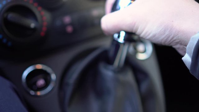 Man Hand Changing Gear Fast during a Race