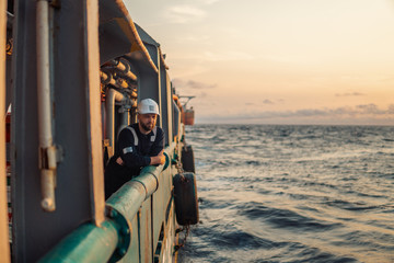 Marine Deck Officer or Chief mate on deck of offshore vessel or ship , wearing PPE personal...