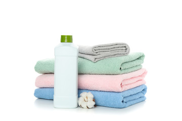 Obraz na płótnie Canvas Folded towels, wash liquid and cotton isolated on white background