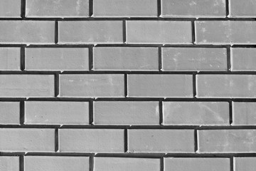 The texture of the new brickwork. Bricks background for design template. Brick wall. Close-up.