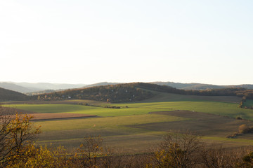 Setting sun on the left side and view of the countryside and surrounding nature panoramic view of the surrounding hills and overlooking the natural airport of Brno captured