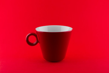 Red cup isolated on red background